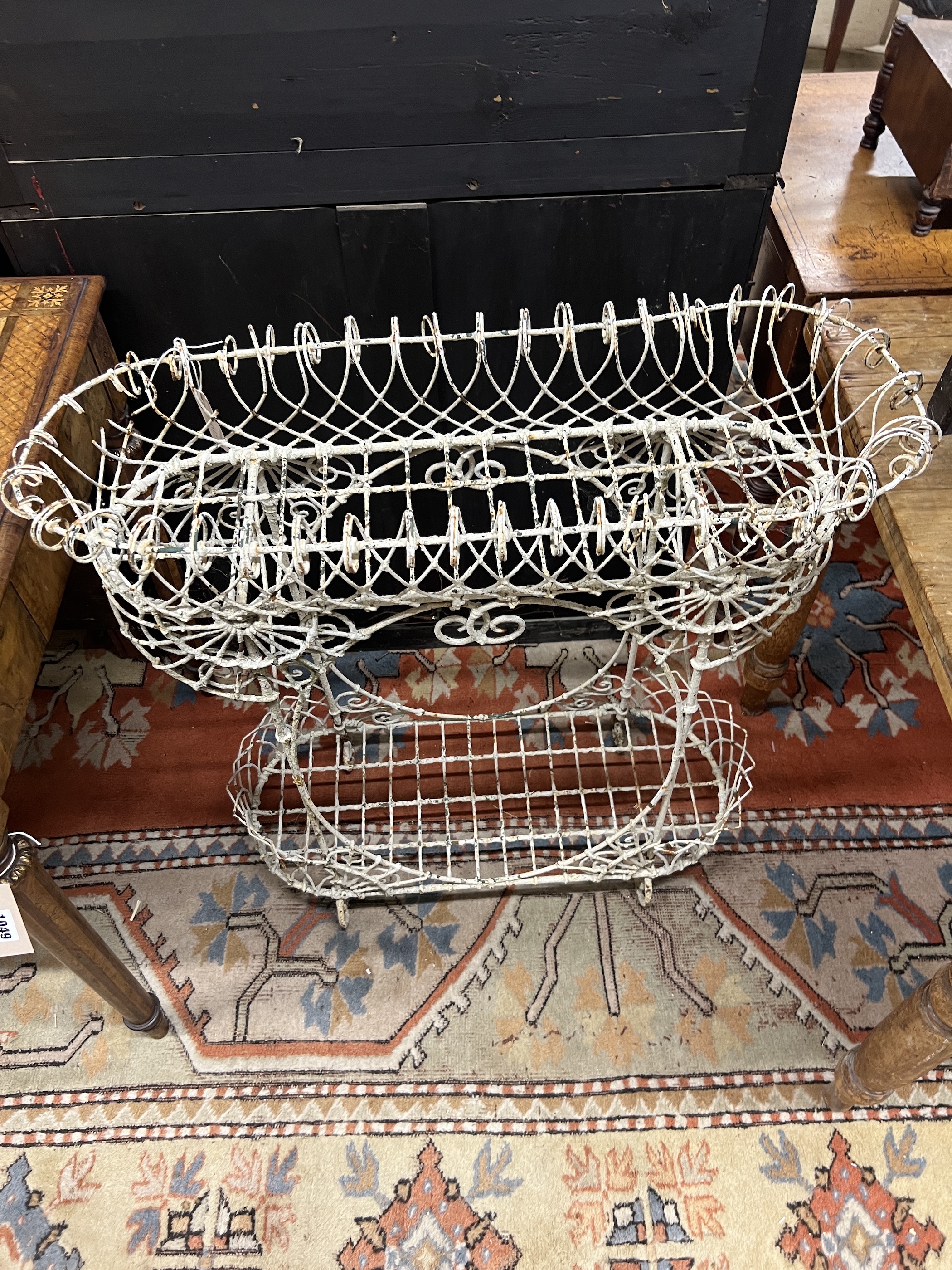 A Victorian painted wirework two tier pot stand, width 79cm, height 82cm